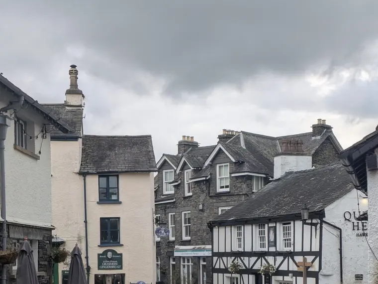 Whitewashed cottages and inns on a street in Hawkshead