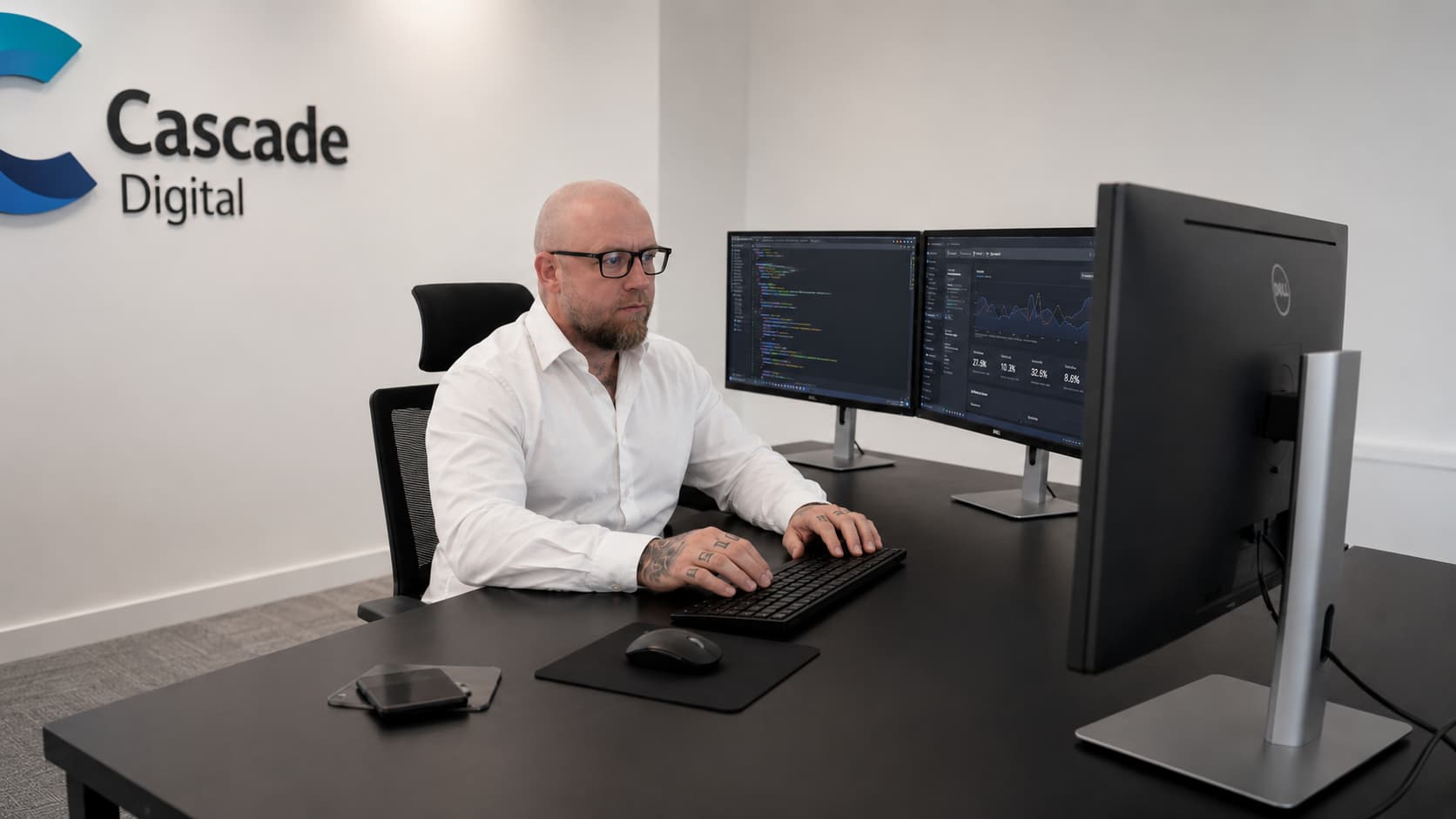Peter, founder of Cascade Digital, at his desk
